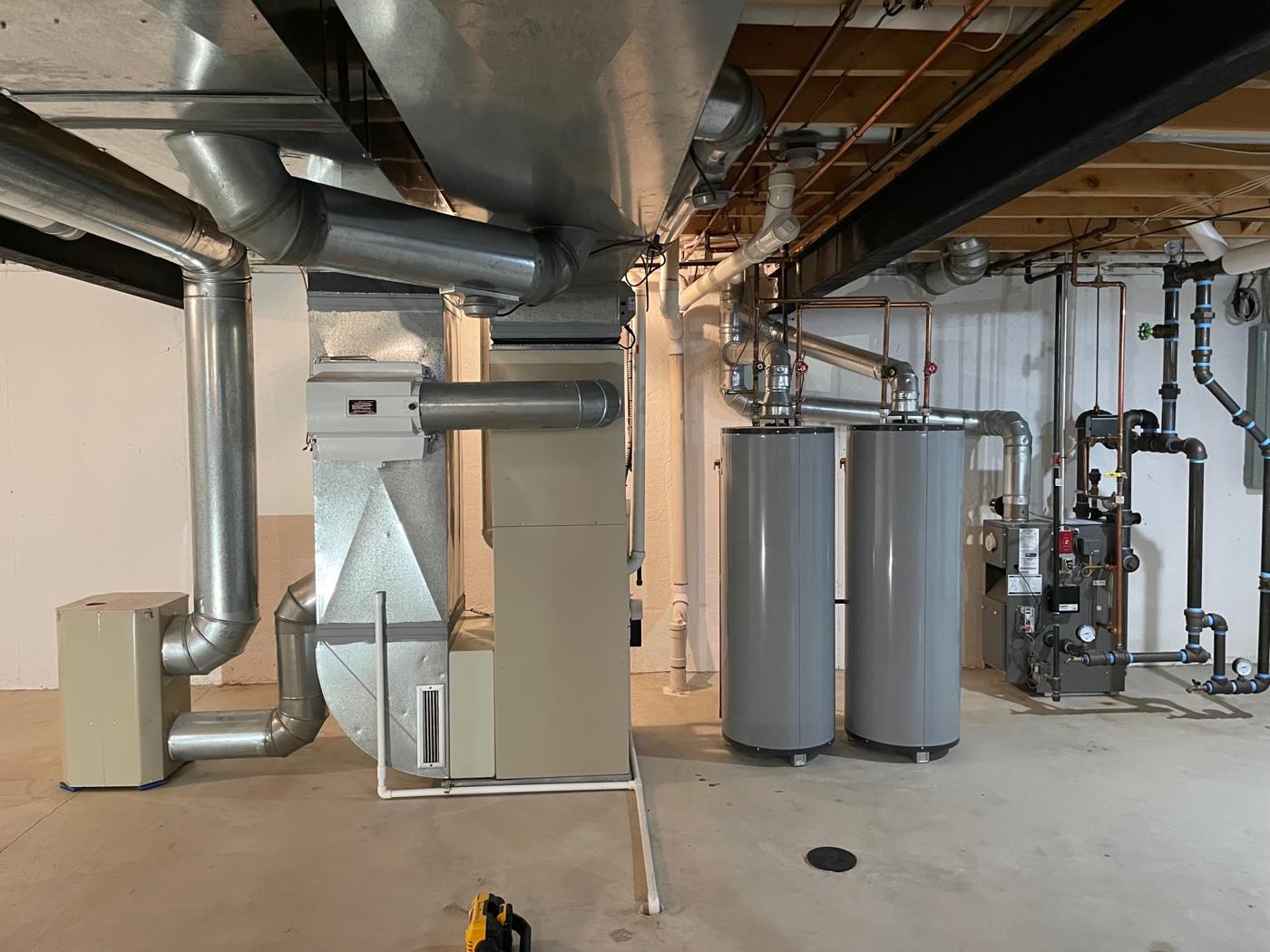 Residential mechanical room with heating equipment, piping and venting